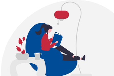 Ragazza che legge su una comoda poltrona